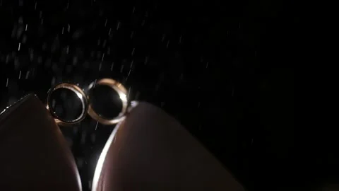 Water drops on the wedding ring Stock Footage 131243624