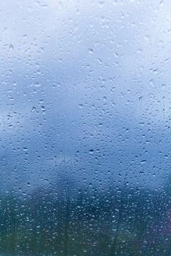 Water drops on window. Background of drops of water rain on glass transparent Stock Photos