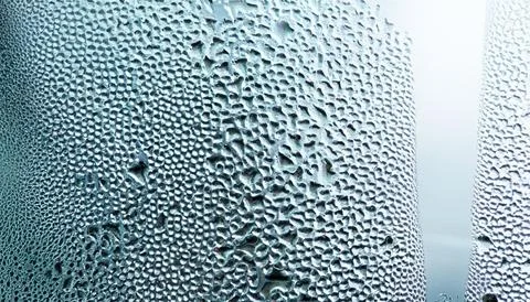 Water drops on the window, close-up. Abstract background. Stock Photos