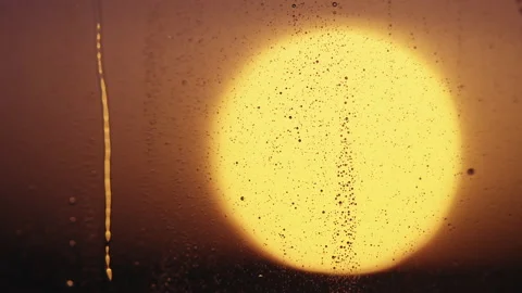 Water drops on window glass with sunset light Stock Footage 204088337