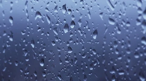 Water drops on a window panning on an angle Stock Footage 45622776