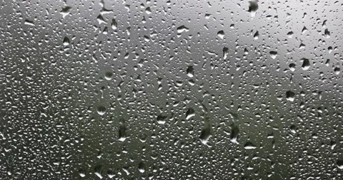 Water drops on window on a rainy day Видео 231901464
