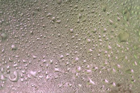 Water drops on a window, textured background, pastel colors, defocused Stock-Fotos