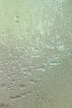 Water drops on a window, textured background, pastel colors, defocused Stock-Fotos