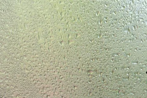 Water drops on a window, textured background, pastel colors, defocused Stock-Fotos