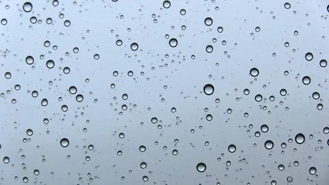 WATER DROPS IN WINDOW WHILE RAINING Stock Footage 94759660