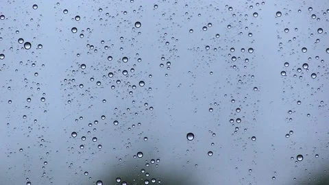 WATER DROPS IN WINDOW WHILE RAINING Stock Footage 94759688