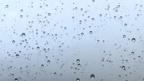 WATER DROPS IN WINDOW WHILE STRONG RAINING Stock Footage 94759658