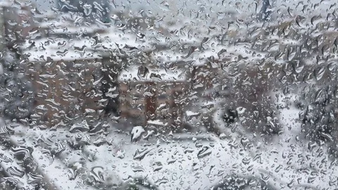 Water drops on windowpane in a snowy day Stock Footage 83728389