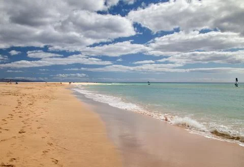 The water edge in the bay of Risco del Paso at cloudy sky Stock Photos