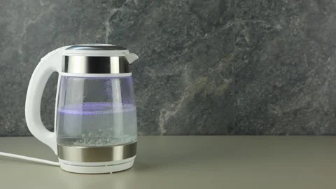 A Glass Electric Kettle With Boiling Water Inside Stock Photo