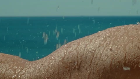 Water end falling on a woman's hips in the sun Stock Footage 161471228