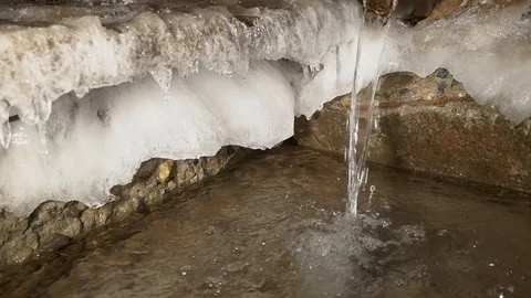 Water is like an endless engine. The source of artesian water flows into the win Stock Footage 99632559