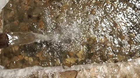 Water is like an endless engine. The source of artesian water flows into the win Video stock 99632840