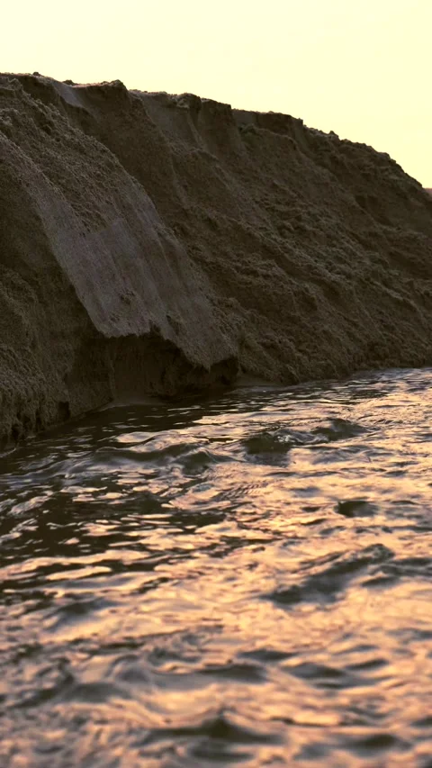 Water Eroding Sand Bank 4k Stock Footage 152963873