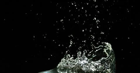 Water Exploding and Splashing against Black Background Foto stock