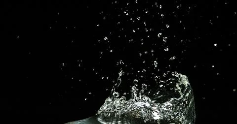 Water Exploding and Splashing against Black Background Foto stock