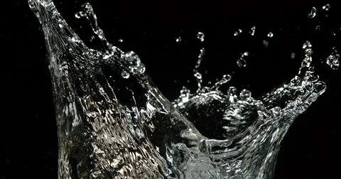 Water Exploding and Splashing against Black Background 写真素材