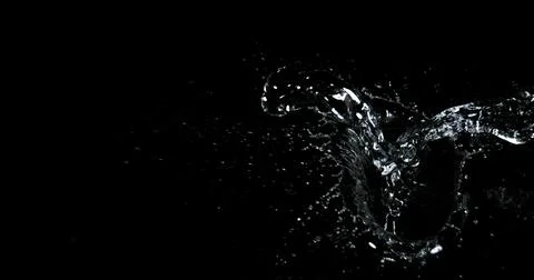 Water Exploding and Splashing against Black Background Stock Photos