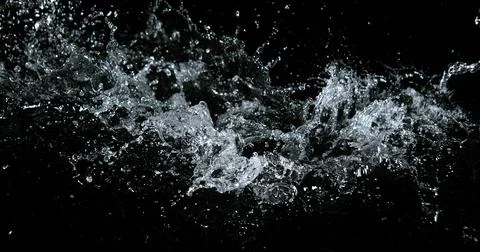 Water Exploding and Splashing against Black Background 写真素材
