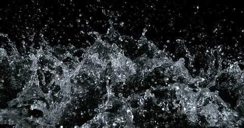 Water Exploding and Splashing against Black Background Foto stock