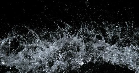 Water Exploding and Splashing against Black Background Foto stock