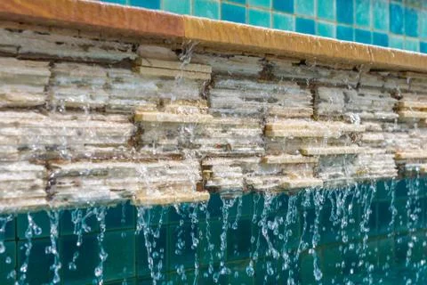 Water fall on brick with tile wall Stock Photos