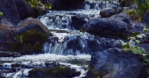 Water fall flowing over volcanic rock Stock Footage 330755227