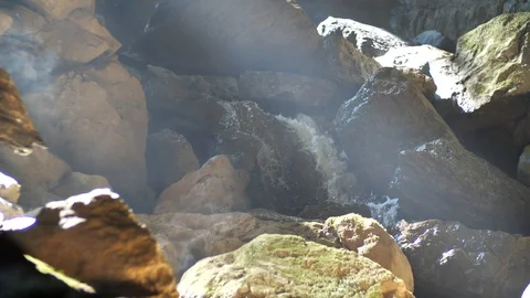 Water fall Natural light in the forest that is shining into the cave entrance. Video stock 128019623