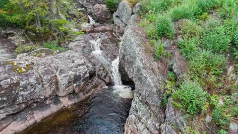 Water fall in slow motion rising camera Stock Footage 249351303