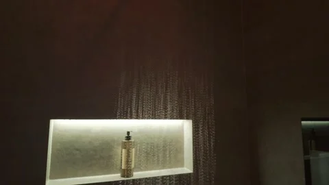 Water falling and splashing on a modern shower floor 스톡 동영상 335784401