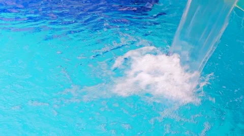 Water falling into blue swimming pool Stock Footage 51400306