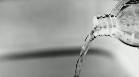 Water falling from the bottle, negative image Stock Footage 34395701