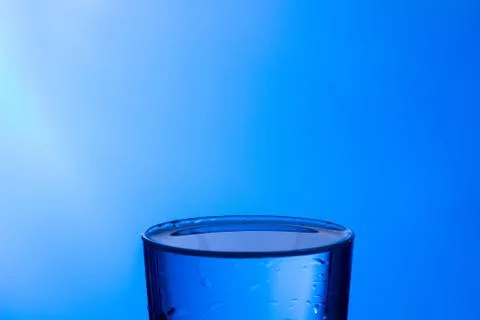 Water falling into a clear glass Stock Photos