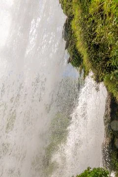 Water falling from the cliffs under Magnificent Huangguoshu Grand Waterfall.. Stock Photos