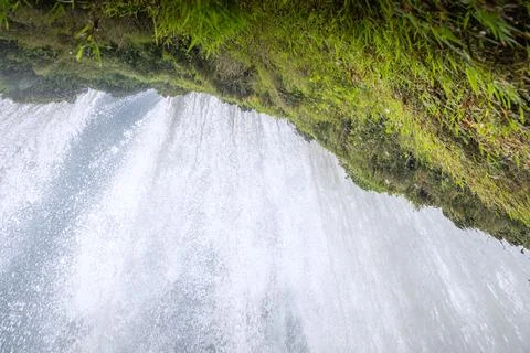 Water falling from the cliffs under Magnificent Huangguoshu Grand Waterfall.. Stock Photos