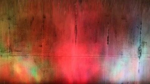 Water falling on a concrete wall on dancing colors Stock Footage 119496211