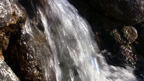 Water falling down in a natural environment Stock Footage 102763610