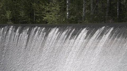 Water falling down in slow motion forest behind Stock Footage 89633558