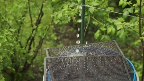 Water is falling down in slow motion into a blue barrel Stock Footage 152995238