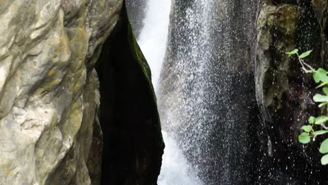Water falling down in slow motion in the Kourtaliotiko canyon Stock Footage 202679033
