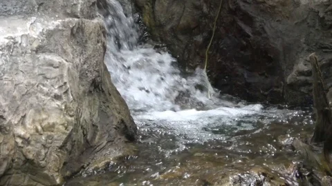 Water falling , flowing down rocks, mountain. Slow motion Stock Footage 106852298