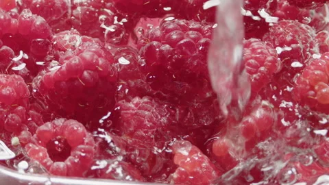 Water falling in fresh raspberry Stock Footage 260686841