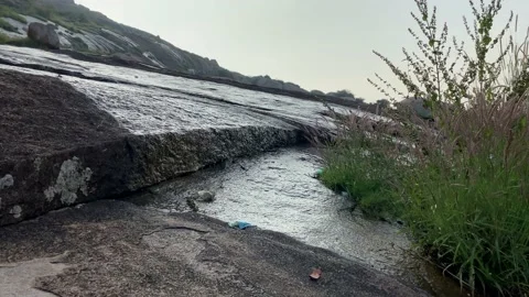 Water falling from mountain rock, waterfall Video stock 167738898