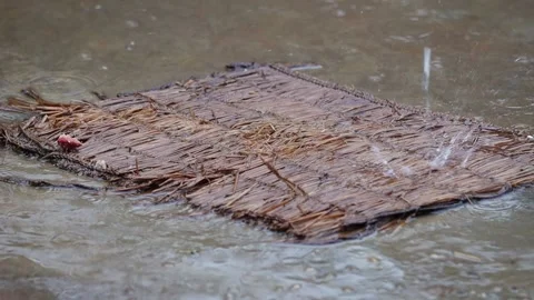 Water falling on the old mat Stock Footage 155366446