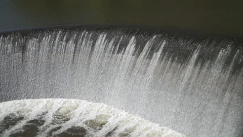 Water falling over a dam Stock Footage 89631925