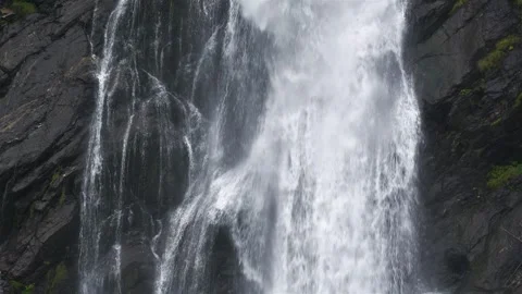 Water Falling Over Dark Rocks, Peaceful Waterfall Stock Footage 323115034