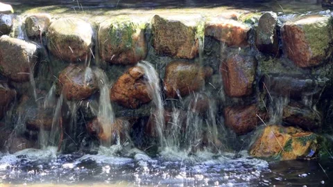 Water falling over little rocks with sound Stock Footage 231038142