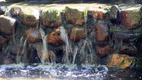 Water falling over little rocks with sound Stock Footage 231038273