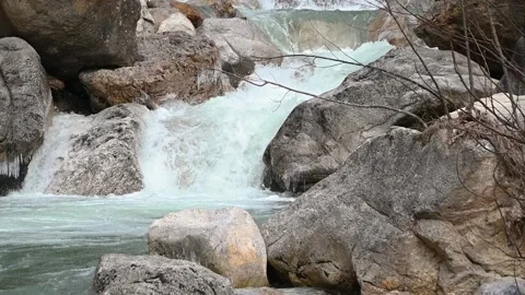 Water falling over orange rocky cascades Stock Footage 150403075